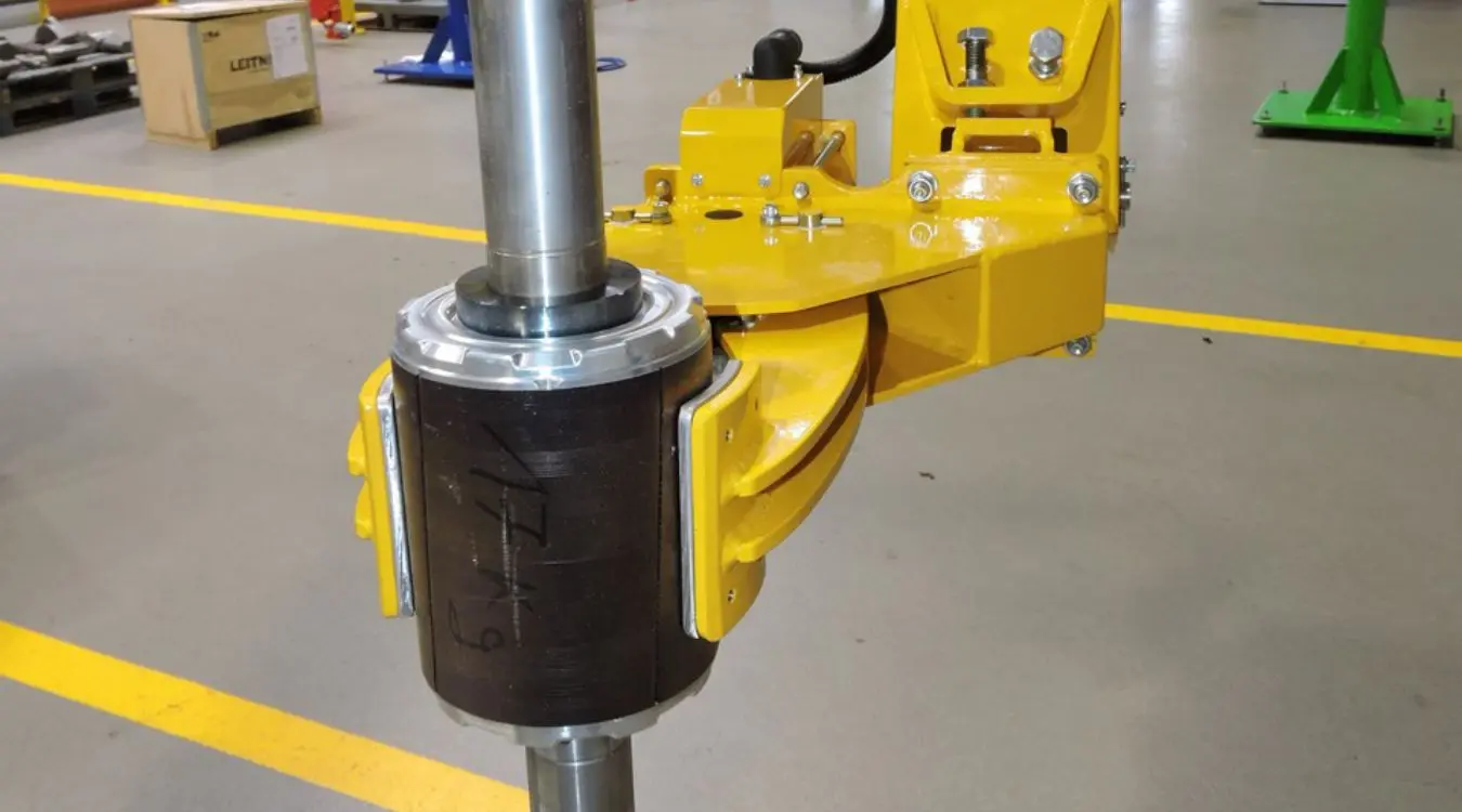 Dalmec custom manipulator gripper for lifting and positioning industrial hoses and specialised mining equipment components safely and ergonomically.