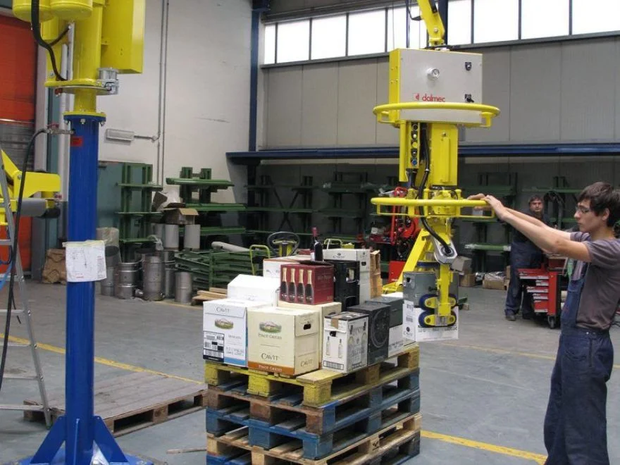 Dalmec manipulator with multi-point gripping frame handling bottled wine cardboard boxes on a pallet in a warehouse facility