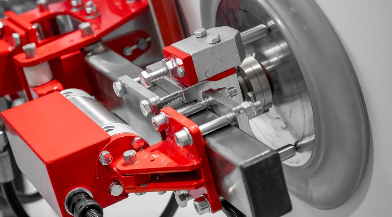 Dalmec custom manipulator gripper handling heavy mining equipment parts for safe alignment and maintenance in industrial facilities