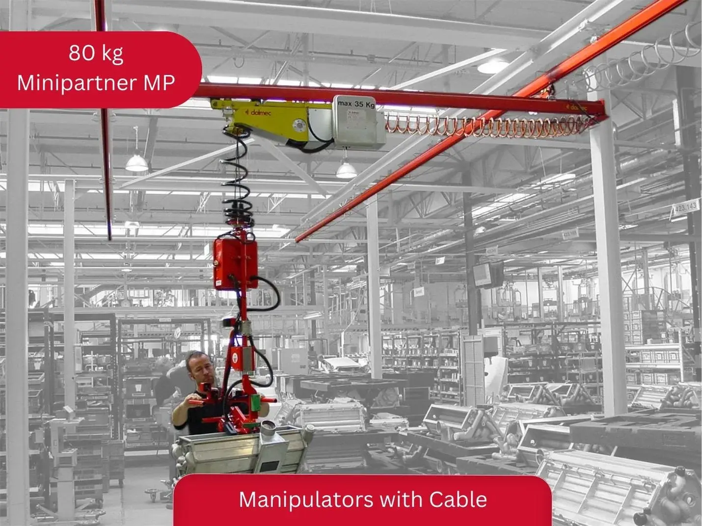 Dalmec Minipartner MP 80kg pneumatic cable manipulator mounted on a bridge crane with double runway system, handling industrial components across a large factory floor