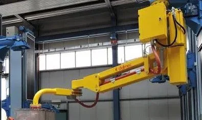 Dalmec manipulator handling a foundry mould inside an industrial casting facility. Image title: Mould Handling Manipulator