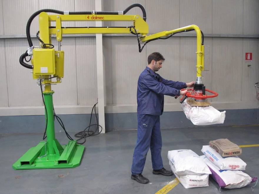 : Dalmec Partner Equo manipulator column-mounted handling heavy hessian sacks in a bulk grain warehouse