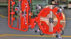 Dalmec manipulator with multi-point gripper handling a large cylindrical tank in an industrial facility