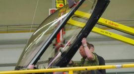 Dalmec precision manipulator handling avionics modules for safe, accurate positioning during aerospace manufacturing.