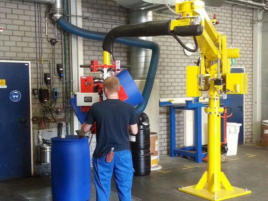 Dalmec manipulator rotating and tilting industrial drums for emptying operations.