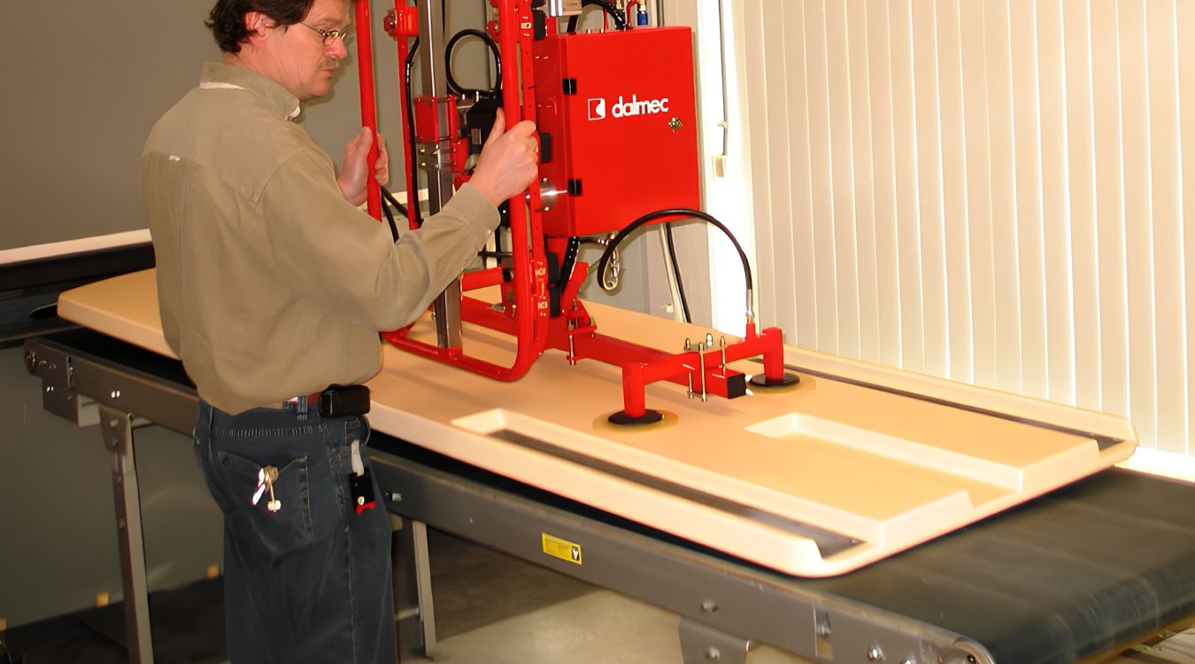 Dalmec vacuum manipulator lifting engineered wood panels for safe, accurate handling in timber manufacturing.