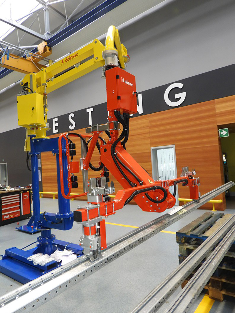 Dalmec ergonomic manipulator positioning aluminium extrusions for production and assembly.