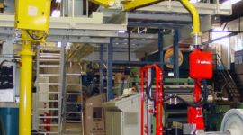 Dalmec manipulator handling industrial plastic storage bins for safe lifting and ergonomic material handling.