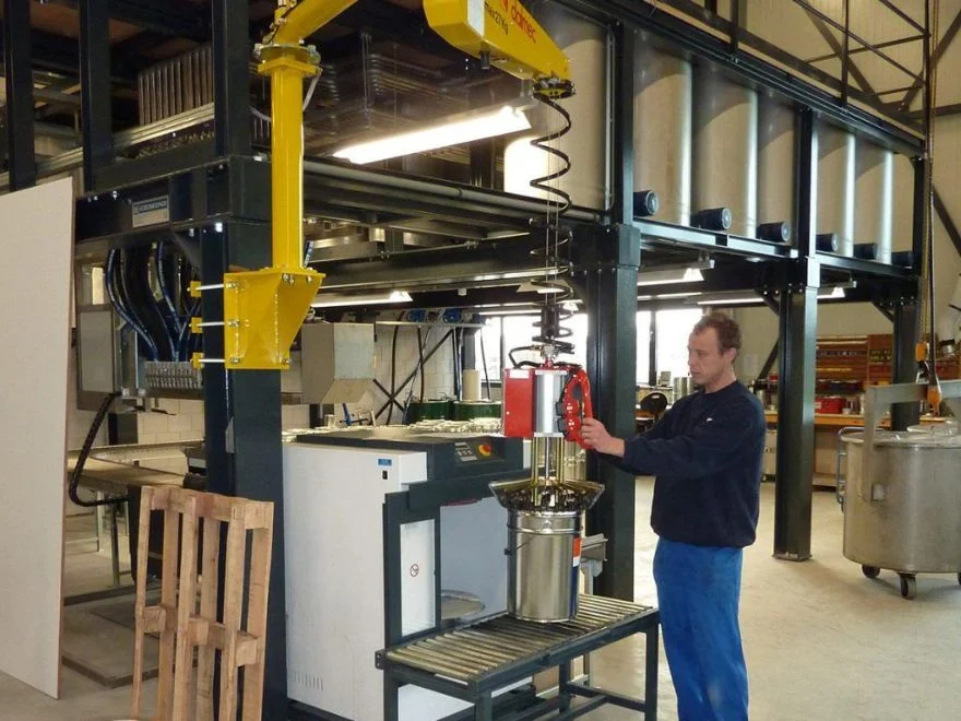 Dalmec manipulator designed for safe handling of metallic pails.