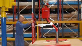 Dalmec vacuum manipulator lifting packaged timber panels for safe and efficient warehouse material handling.