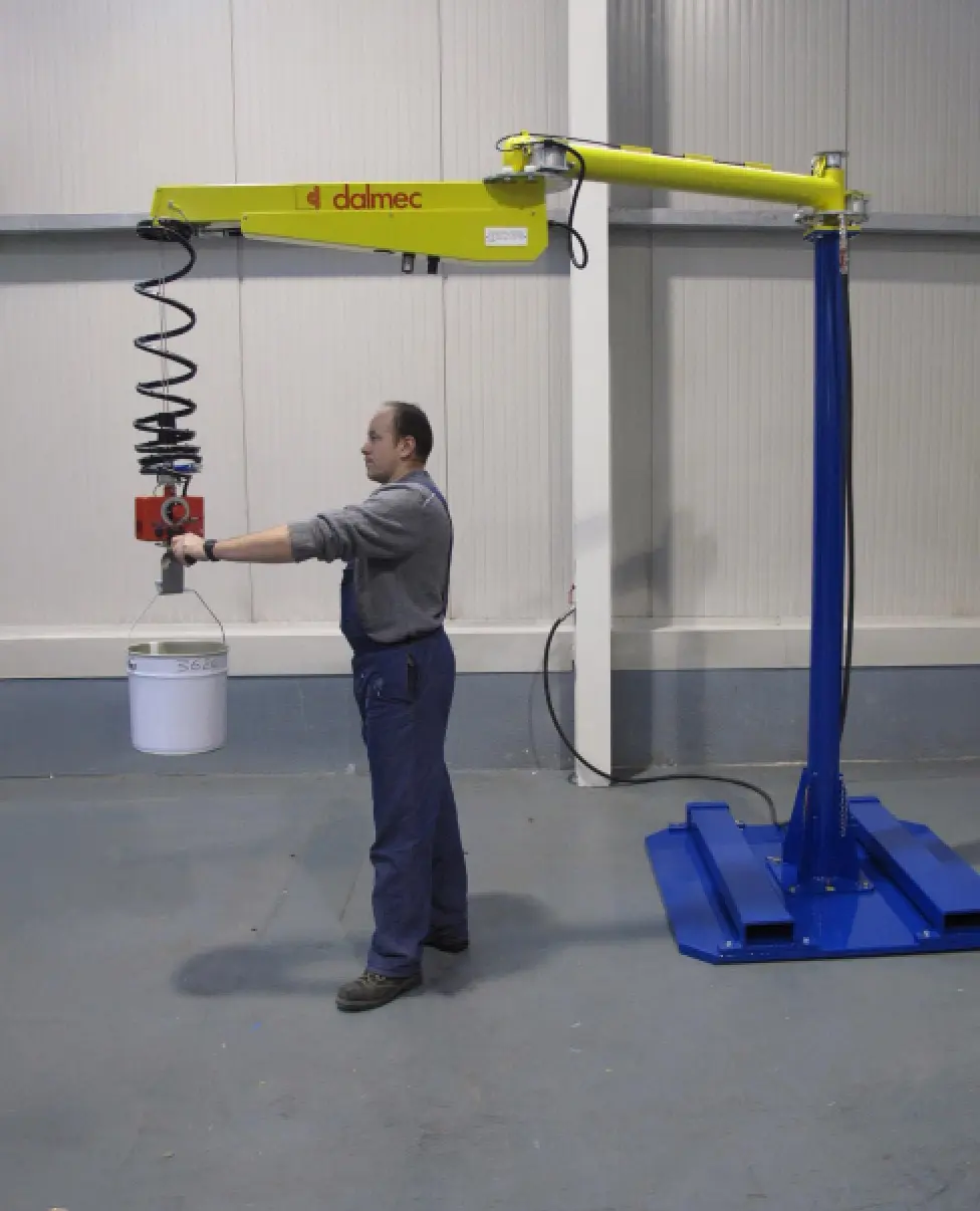 Dalmec pneumatic manipulator lifting paint packaging containers with accurate positioning and minimal operator effort.