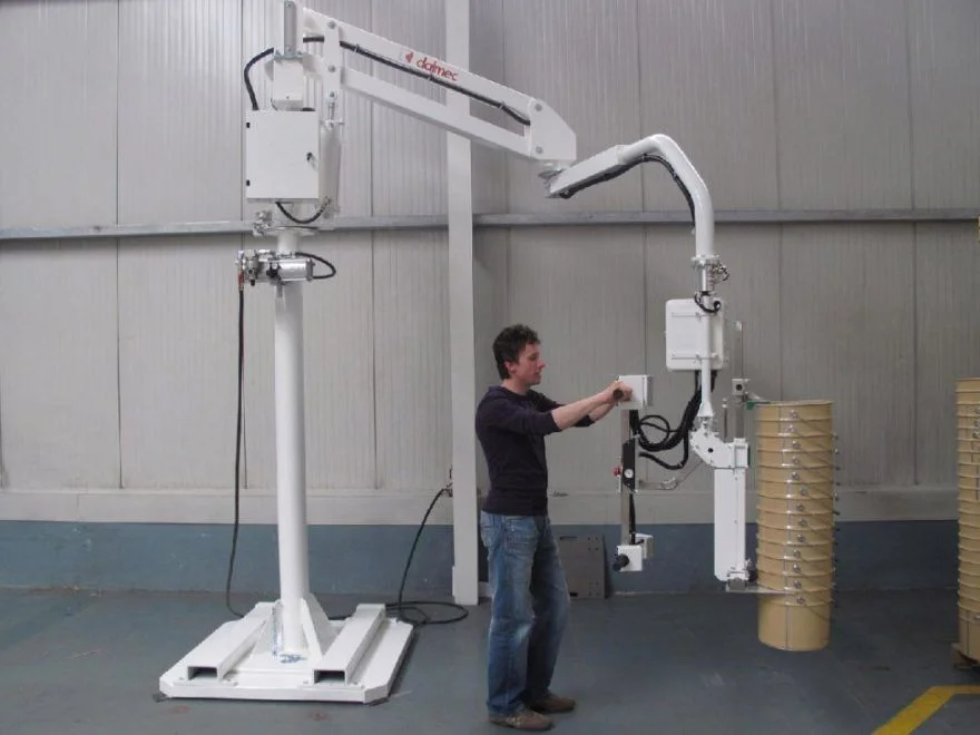 Dalmec manipulator lifting plastic pails for production and packaging operations.
