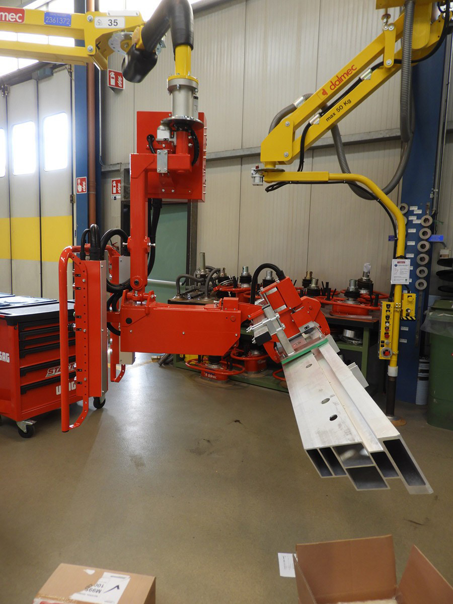 Dalmec pneumatic lifting solution handling long rods and shafts with accurate positioning.