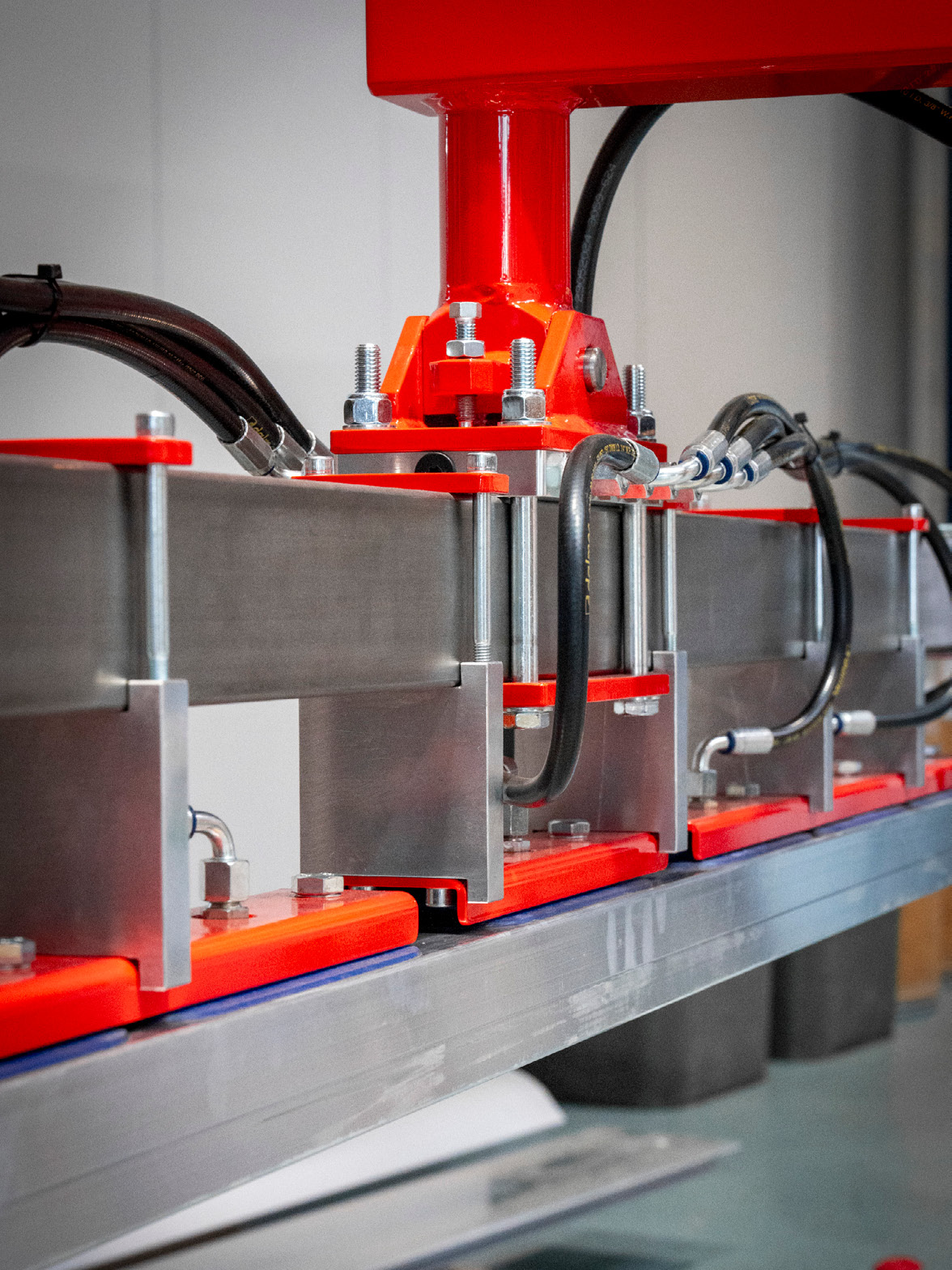 Dalmec industrial manipulator handling long steel profiles safely during manufacturing.