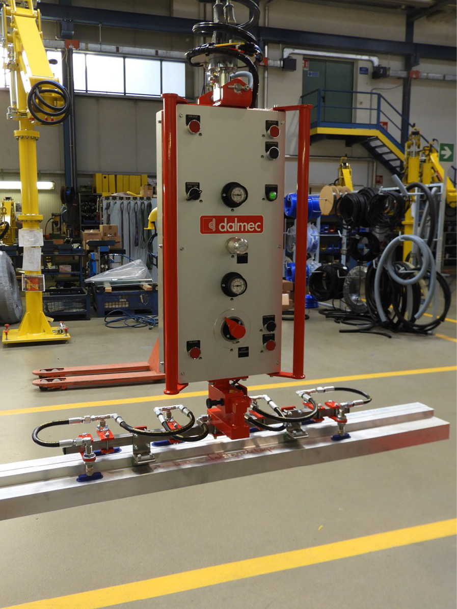 Dalmec custom manipulator handling long structural sections with balanced lifting and precise control.