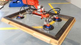 Dalmec manipulator handling structural timber components for safe lifting and accurate positioning in timber processing.