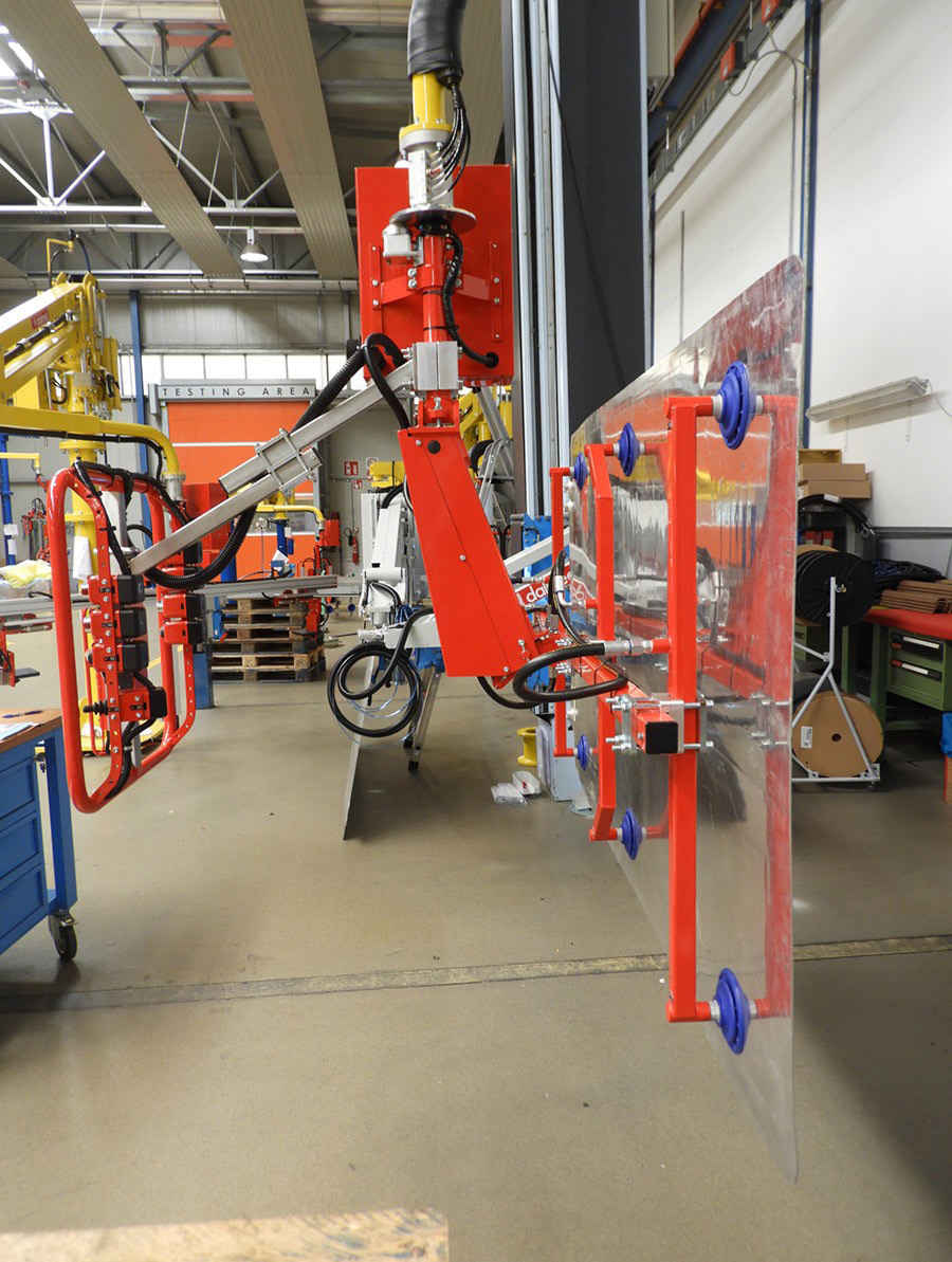 Dalmec vacuum manipulator positioning a large steel sheet vertically for fabrication and processing.