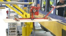 Dalmec manipulator lifting and positioning completed window assemblies for ergonomic manufacturing and installation.